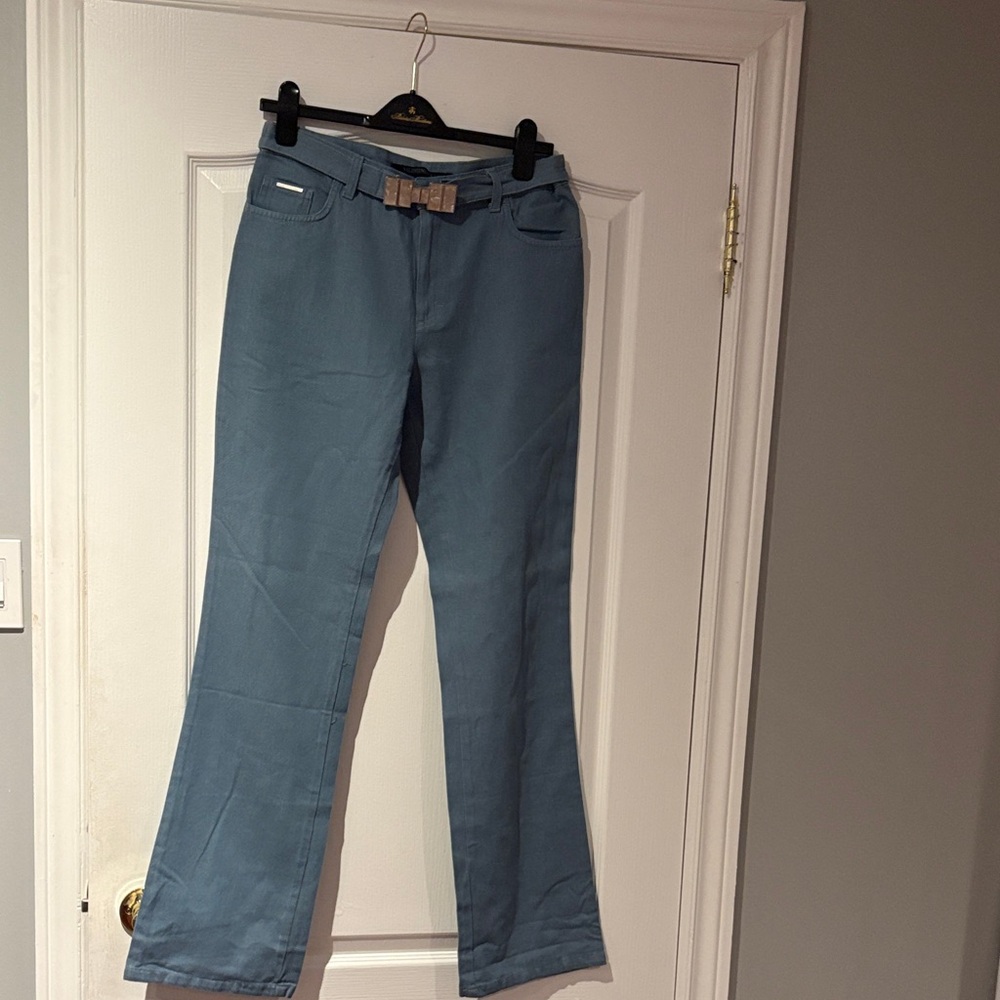 Valentino Light Blue Denim Jeans with mother of pearl style buckle belt.